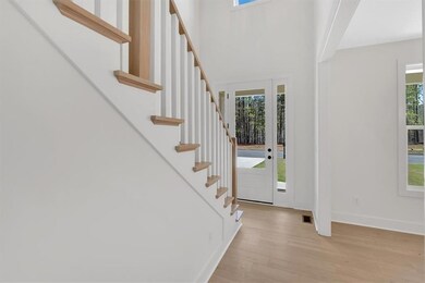 Foyer entrance with light wood finished floors, st