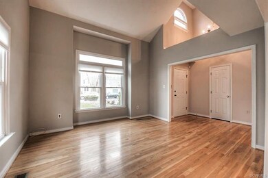 Living Room With Bow Window & Hardwoods