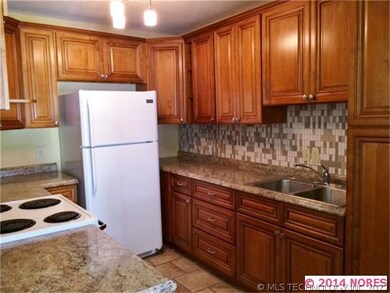 View of kitchen from pass through in dining room.