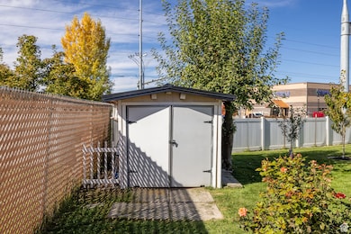 View of shed with a fenced backyard