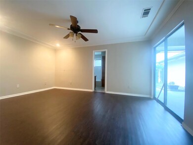 Primary  bedroom with ceiling fan, ornamental mold