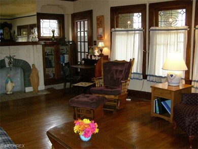 1st Floor Unit Living Room.  Note leaded glass win