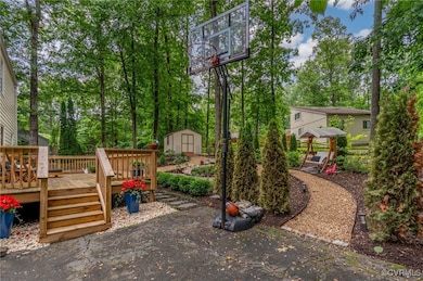 View of yard with a wooden deck and view of scatte