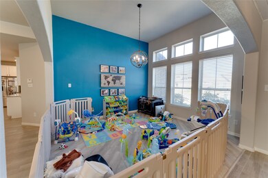 Formal dining area currently being used as a play room.