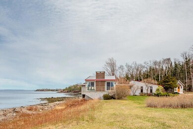 This contemporary home sits upon...