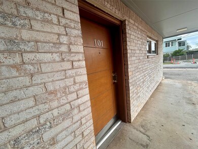 Entrance to property with brick siding