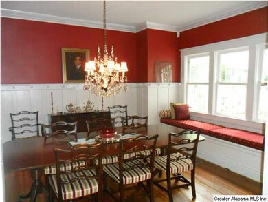 Oversized formal dining room with wainscoting, a b