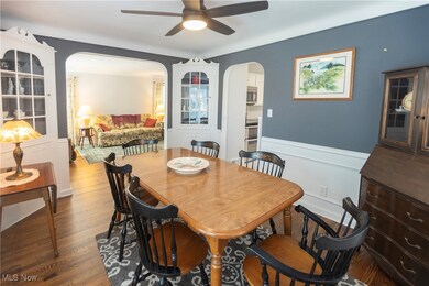Dining area with hardwood / wood-style flooring and ceiling fan