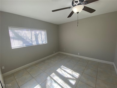 Empty room with light tile patterned floors, ceili