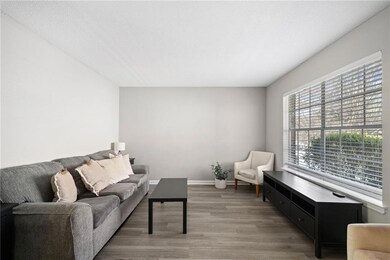 The living room gets tons of natural light due to the huge window. The wide walls allow for many different furniture designs and configurations.