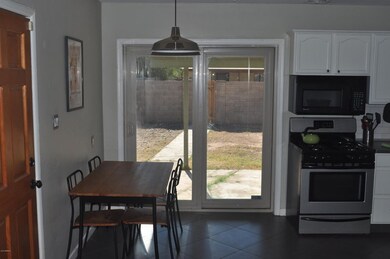 Eat-in kitchen with sliding doors into b