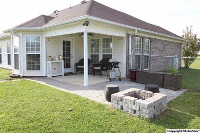 THE BACKYARD IS FENCED AND OFFERS THIS COVERED AND EXTENDED PATIO FOR BBQS AND ENJOYING THE DAY!