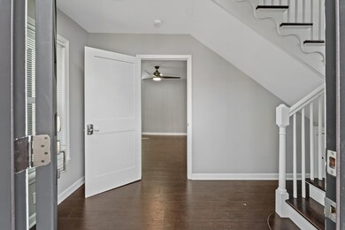 The interior features updates throughout including gorgeous floors, a brand new kitchen, updated bathroom, new appliances including the refrigerator, range, dishwasher, a built in microwave, washer/dryer combo, and an electric fireplace.