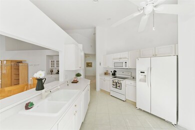 Kicthen & Dining Room Pass Through with Built-in Nook in Background