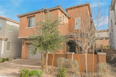 Mediterranean / spanish-style house featuring stucco siding, a garage, a tile roof, and decorative driveway