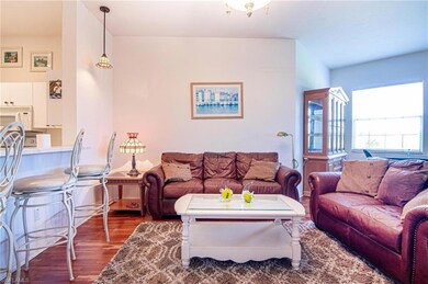 Living room with hardwood / wood-style flooring