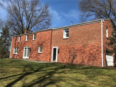 Level then gently sloping backyard with patio off 