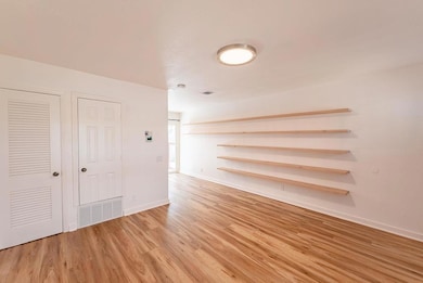 Unfurnished room featuring baseboards, visible ve