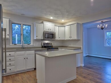 Remodeled kitchen with new quartz...