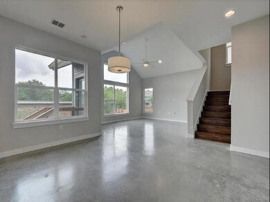 Unfurnished living room with baseboards, a ceilin