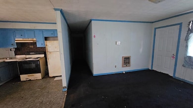 Kitchen with white appliances, under cabinet range