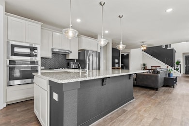 Kitchen featuring appliances with stainless steel