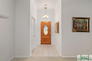 Garage entry into foyer, super high ceilings in th