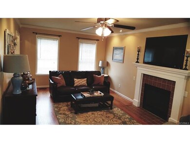 Large family room with laminate hardwoods, ceramic