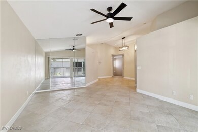 Empty room featuring light tile patterned floors,
