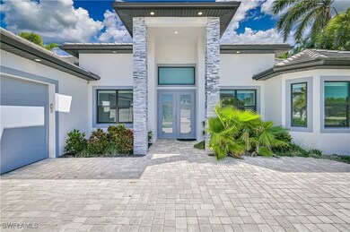 Property entrance with stucco siding, an attached