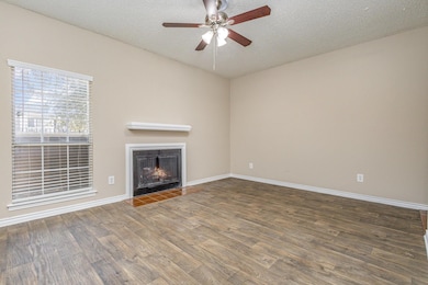 Unfurnished living room with wood finished floors,