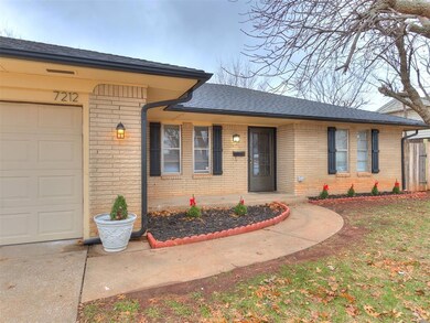 Single story home featuring brick siding, a shingl