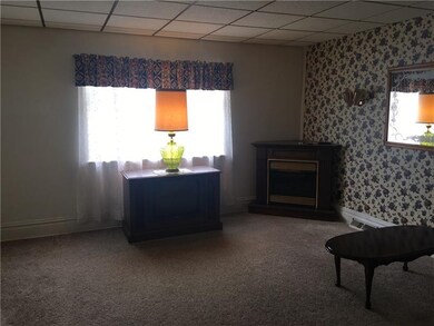 Living room to the left.  Two large windows with p