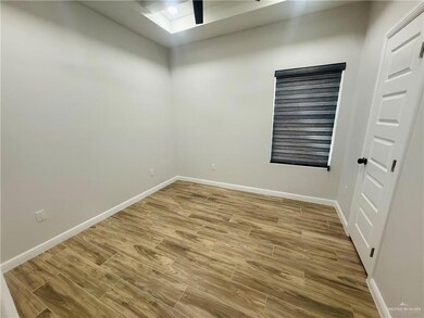 Spare room with wood finish floors