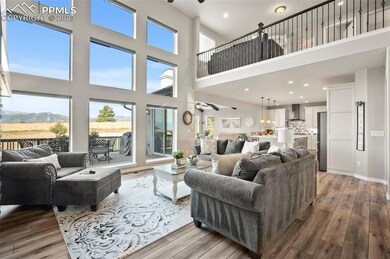 Two story living room facing the mountains