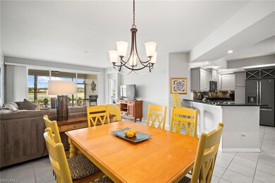 Dining area with light tile patterned floors, a chandelier, recessed lighting, and baseboards