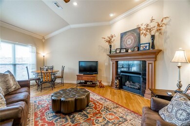 Rich hardwood flooring and cozy fireiplace.