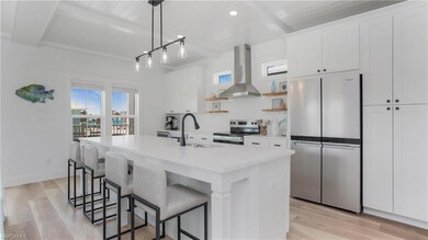 Kitchen with stainless steel appliances, a sink, b