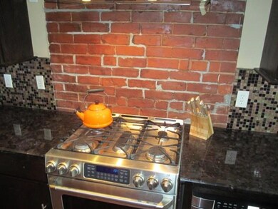 Granite counters, 5 burner natural gas range oven,