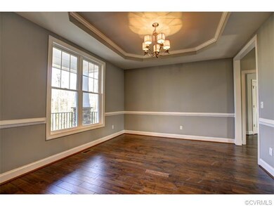 The formal dining room lets in tons of natural lig