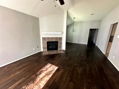 Living room with gas fireplace upon entry.