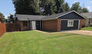 Ranch-style home with brick siding