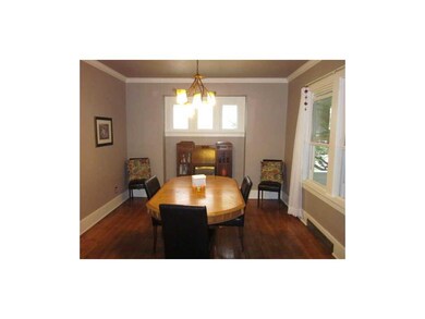 Formal Dining Room. Charming room with warm wood a