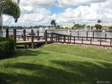 Side yard looking toward dock with expansive water
