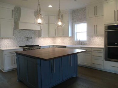Kitchen offers an abundance of cabinets and tile b