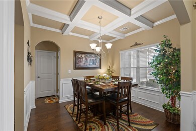 Formal dining room with arched doorways