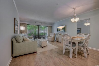 Living room with an inviting chandelier and light 