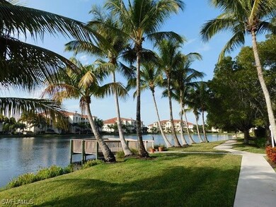 View of community with a water view and a yard
