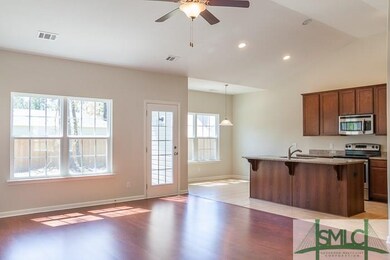 Large, bright great room with vaulted ceiling open