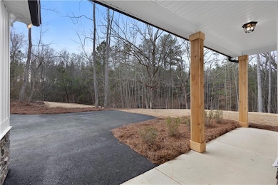 View of patio / terrace with a view of trees
